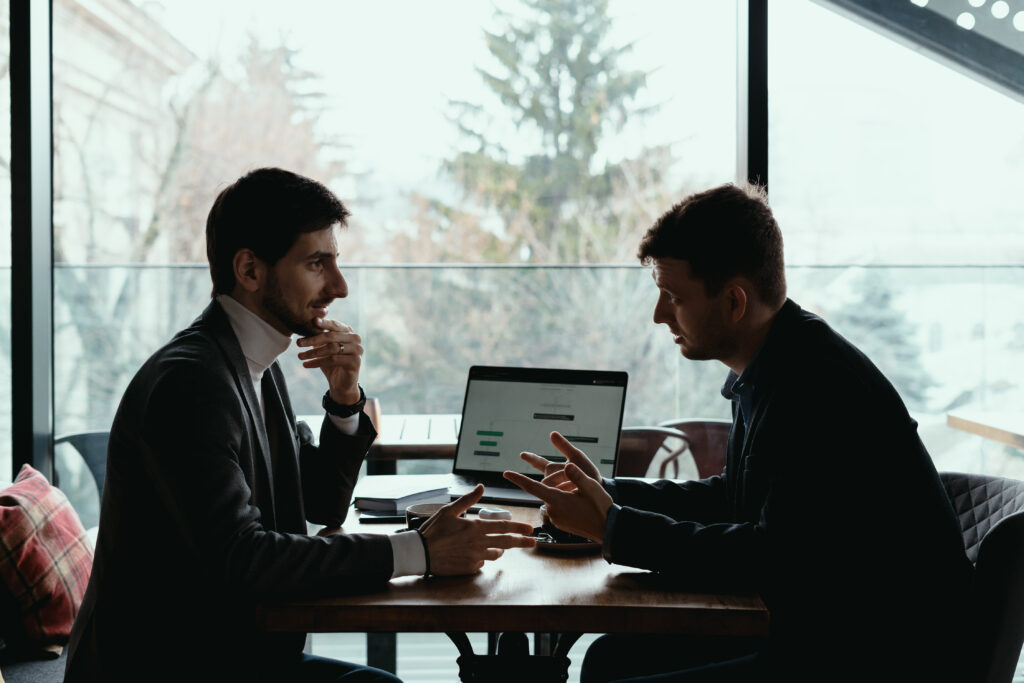 Colleagues discussing Retention vs Acquisition